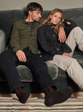 A long-sleeved green flannel shirt with a collar, button-up front, and a regular fit.
