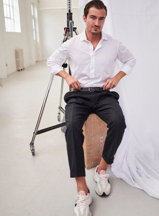 sustainable menswear white recycled italian mens popover shirt with black trousers 